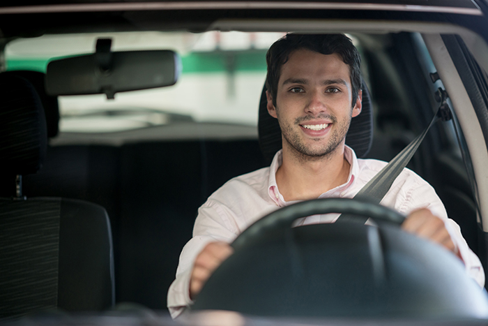 man smiling driving