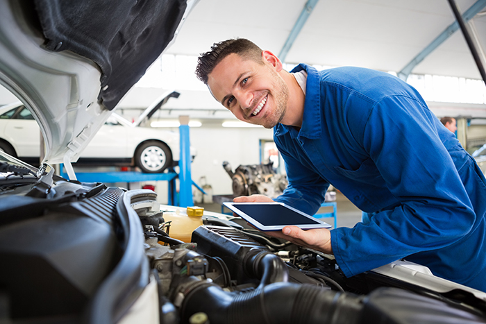 man working on car