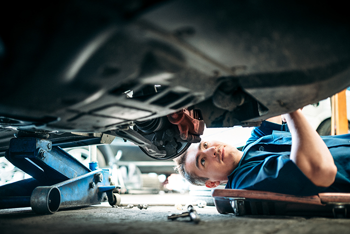man under car