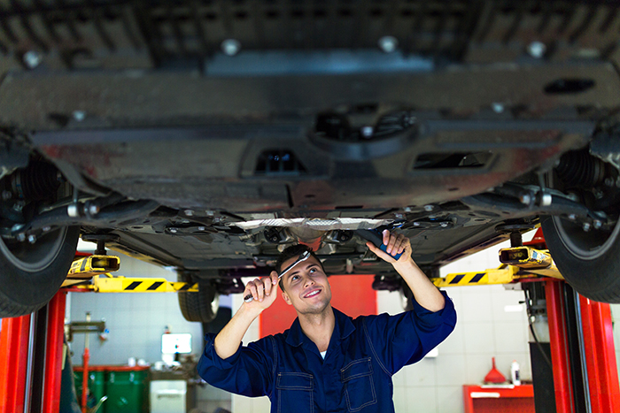 mechanic under car